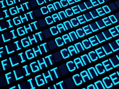 Flight board at airport shows flights cancelled - tui uk