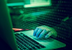 Hacker on laptop regarding the Ticketmaster group litigation after data breach