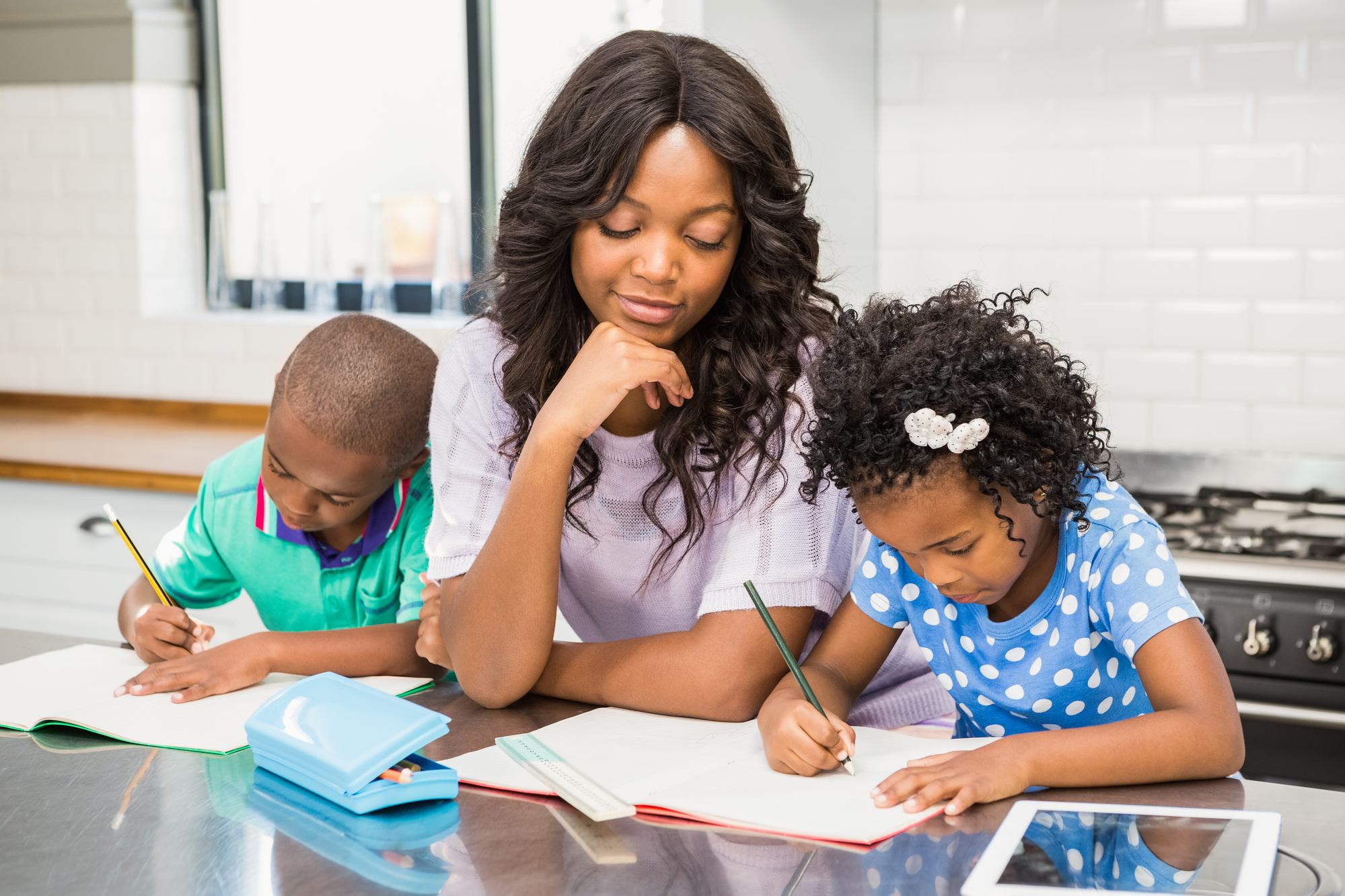Mom and children home schooling regarding school closures in UK amid covid