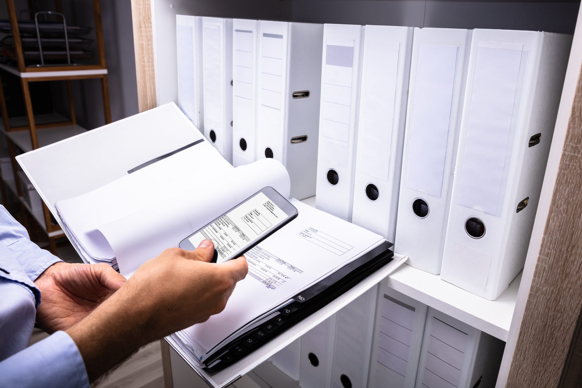 Assesor taking phot of documents regarding Capita data breach