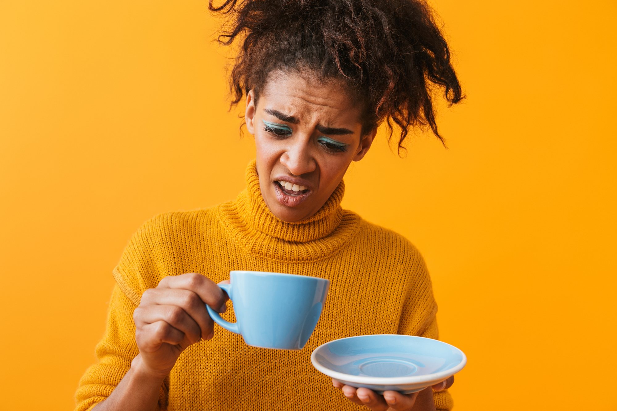 woman disgusted with coffee regarding Nestle recall of espresso